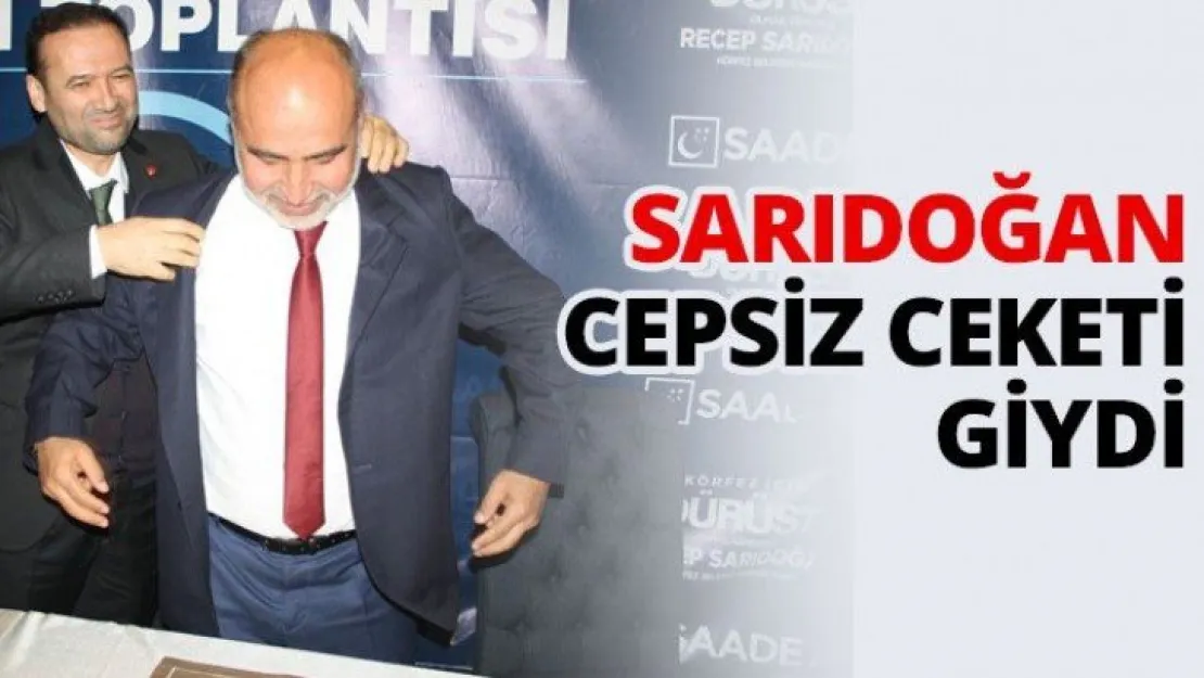 Sarıdoğan cepsiz ceketi giydi