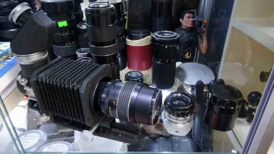 Sesi makineli tüfek, kendisi fotoğraf makinesi